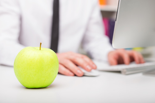 Man having fruit at work